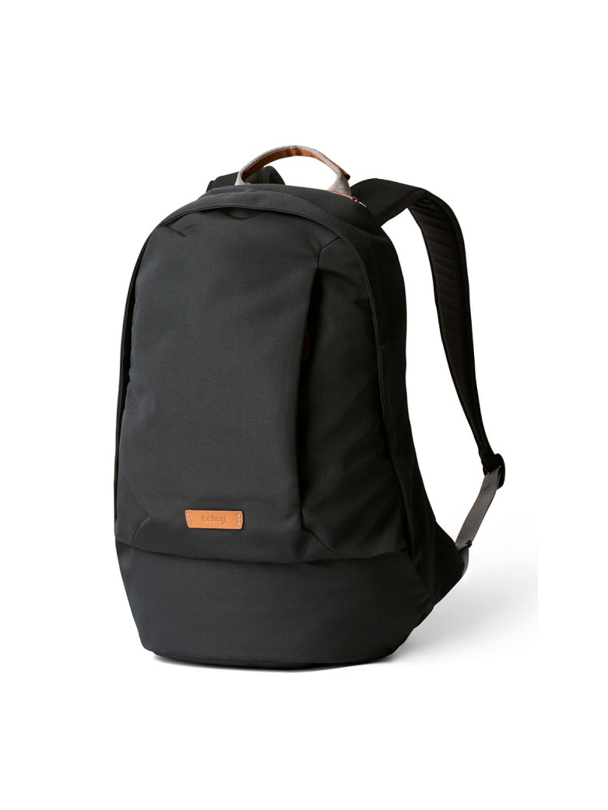The Bellroy Classic Backpack - 20L is a black urban bag with padded shoulder straps, a top handle, and a brown leather logo patch on the front. Made from recycled materials, it is shown against a plain white background.
