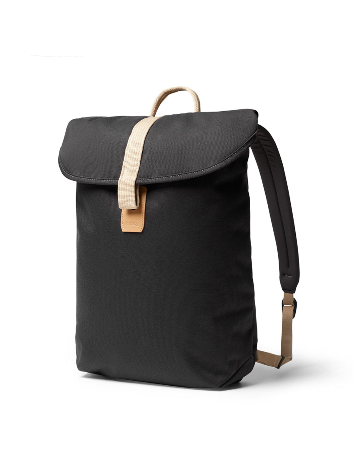The Bellroy Oslo Backpack is a minimalist black backpack with a large flap closure, beige strap and handle, padded shoulder straps, and a rectangular shape for a sleek, modern look.