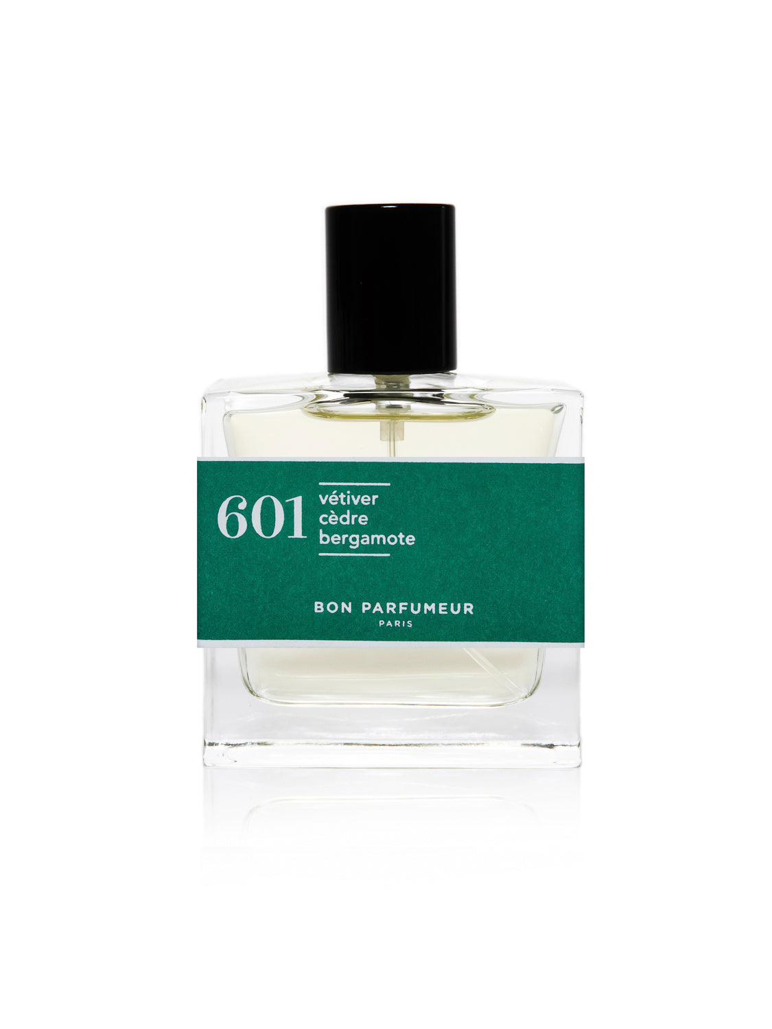 A clear perfume bottle with a black cap and green label reads 601 vétiver cèdre bergamote by Bon Parfumeur Paris. This cruelty-free fragrance, made in France, contains a light-colored liquid.