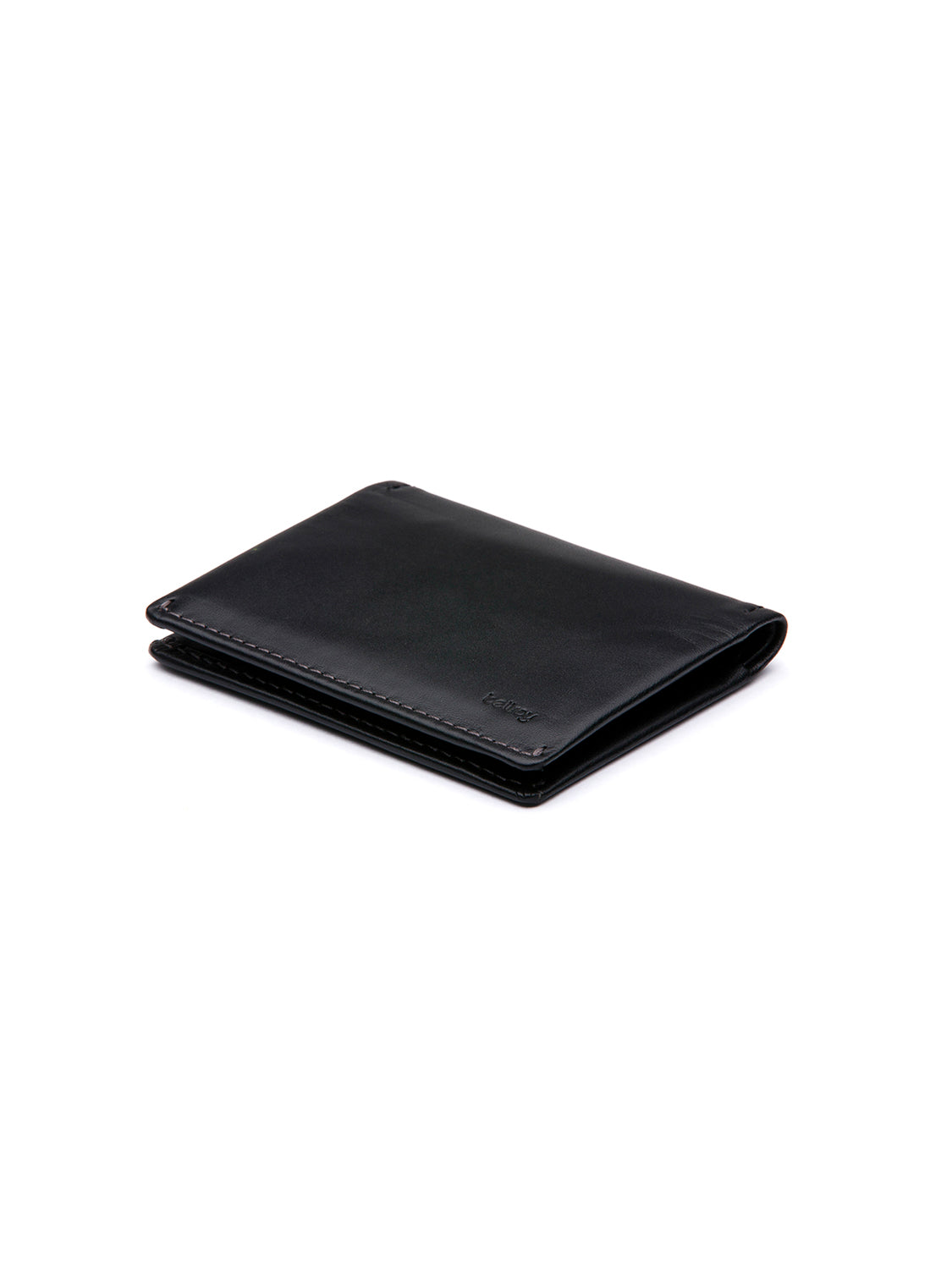 The Bellroy Slim Sleeve Wallet, crafted in smooth black leather, sits against a white background, presenting a compact, pocket-friendly option for everyday use.