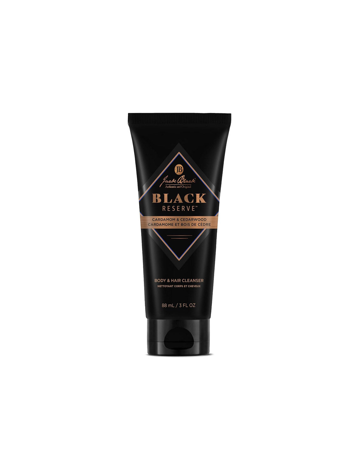 A black tube of Jack Black Body and Hair Cleanser stands upright on a white background, featuring gold and white label text. This sulfate-free formula is scented with cardamom and cedarwood.