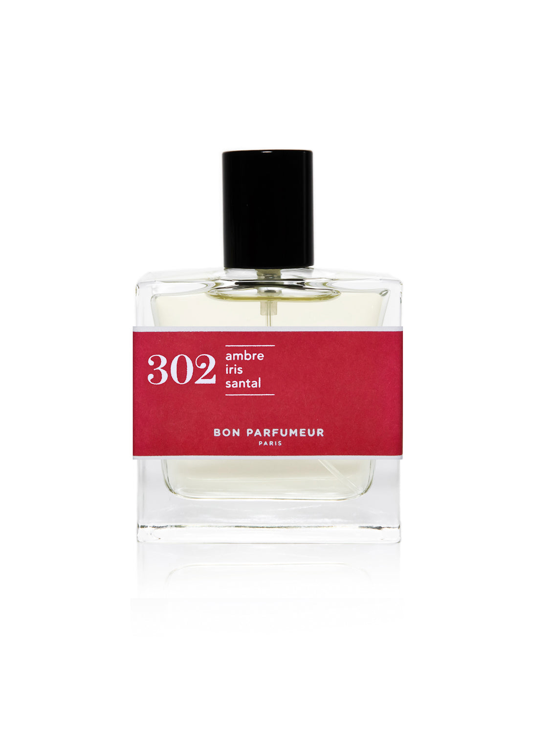 The Bon Parfumeur - 302 perfume features a clear bottle with a black cap, partially wrapped in a red label that reads 302 ambre iris santal and Bon Parfumeur Paris. Inside, the light yellow liquid combines sandalwood with an enchanting fragrance profile.