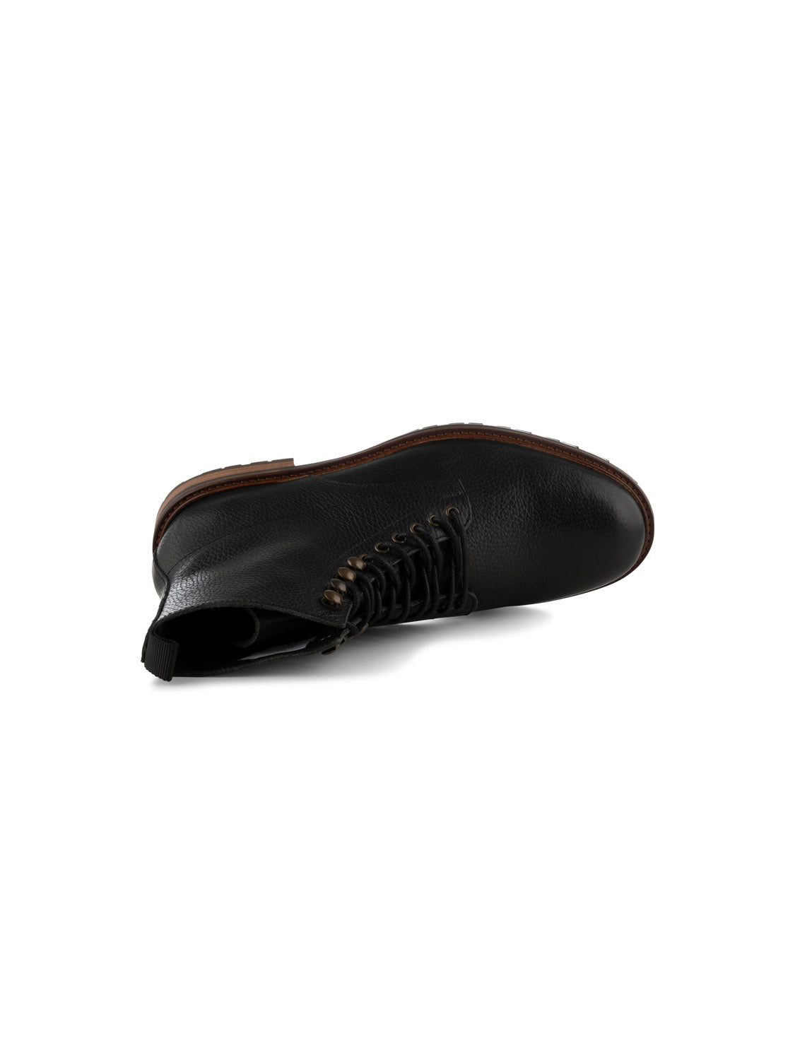The York Lace Up Leather Boot from Shoe The Bear is showcased from the side on a white background. Its a single black lace-up boot with metal eyelets, brown sole, and crafted in LWG-certified leather in Portugal, slightly tilted to highlight the laces and texture.
