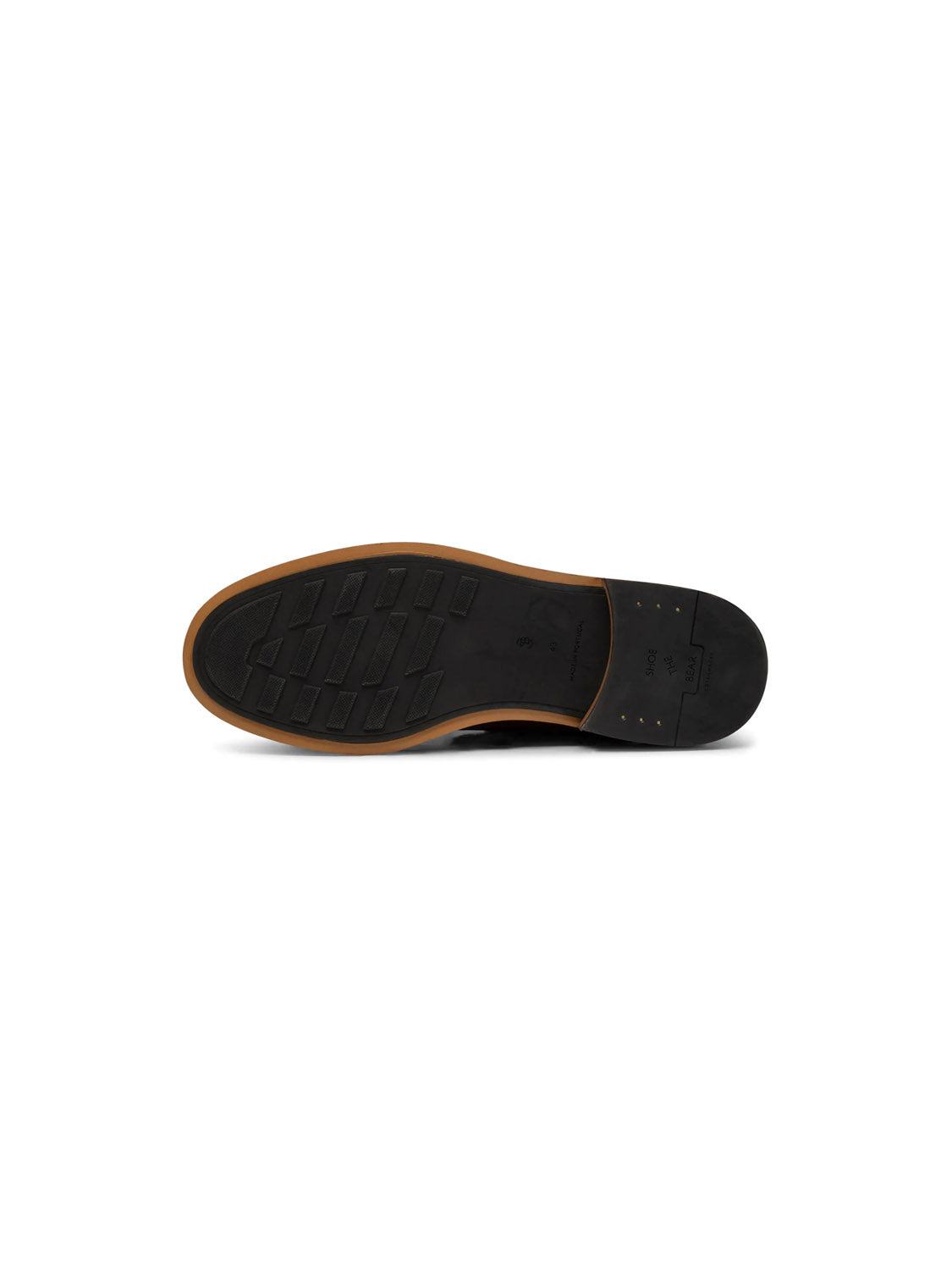 The Curtis Hand Crafted Lace-Up Boots by Shoe The Bear feature a black sole with brown trim and a ridged tread for grip. Handcrafted in Portugal with a slightly raised heel and small central markings, the boots are displayed against a plain white background.