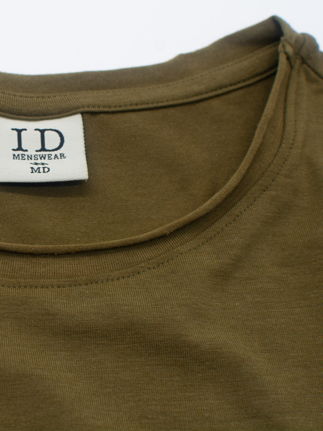 Close-up of the Bello Bamboo Blend Rolled Neck Tee from ID Menswear, showcasing its neckline and tag. The olive green fabric appears soft and textured, offering a sustainable choice.