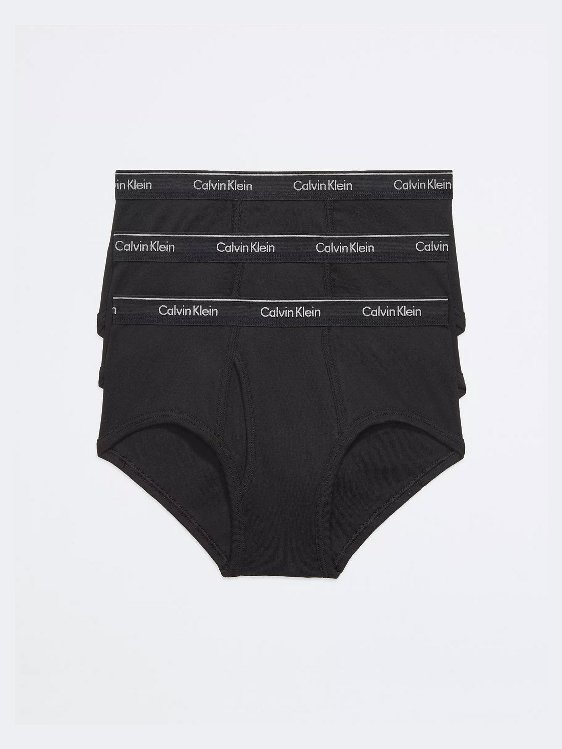 Three pairs of Calvin Klein NB3999 3-Pack Classic Cotton Briefs are stacked, showcasing the white Calvin Klein logo on the waistband. These men's underwear are neatly arranged against a plain white background.