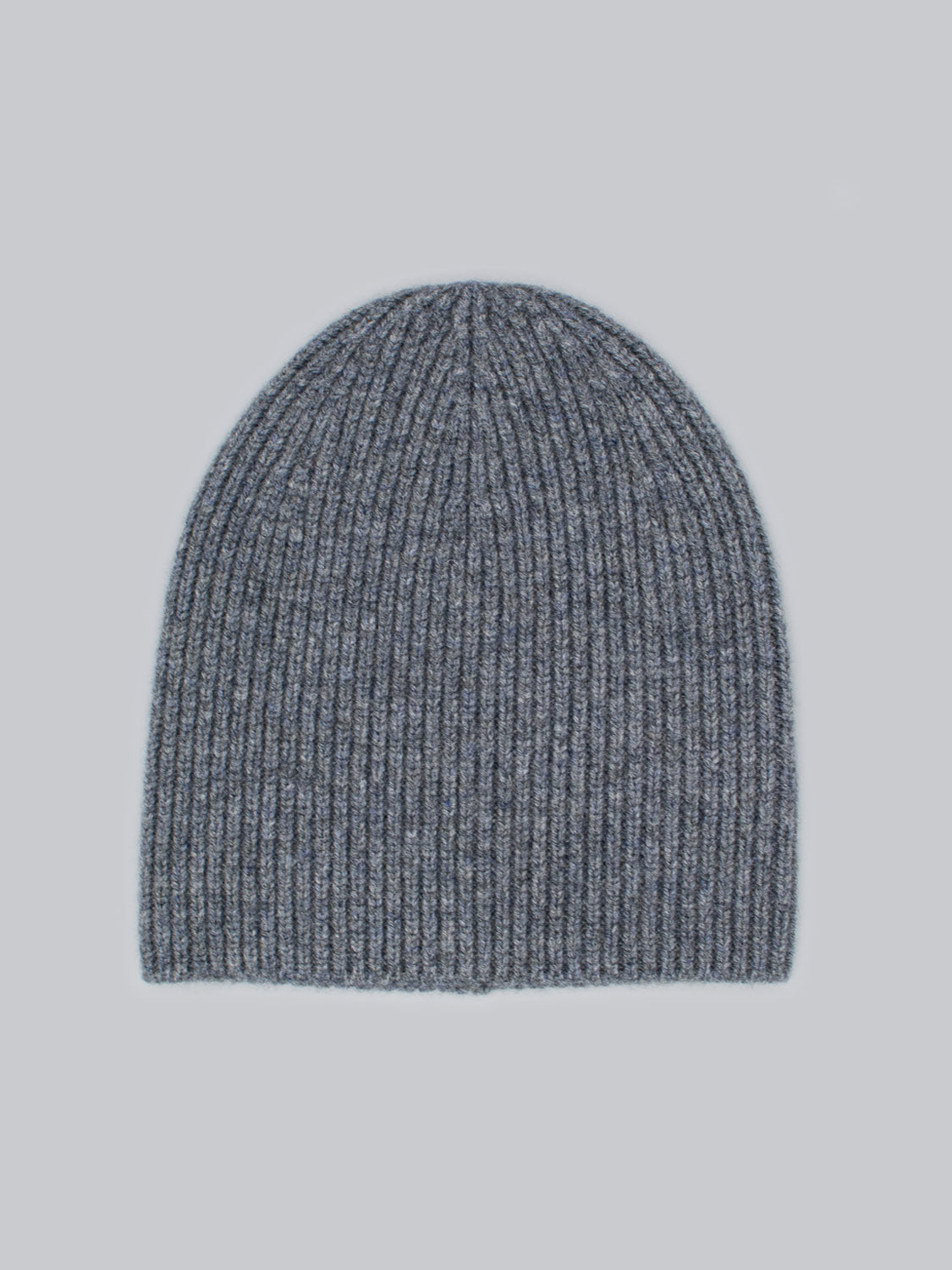 The Chamonix Wool Beanie by ID Menswear, made from 100% wool with a ribbed knit texture, is showcased against a light blue background. Its gray, rounded design offers warmth and insulation.