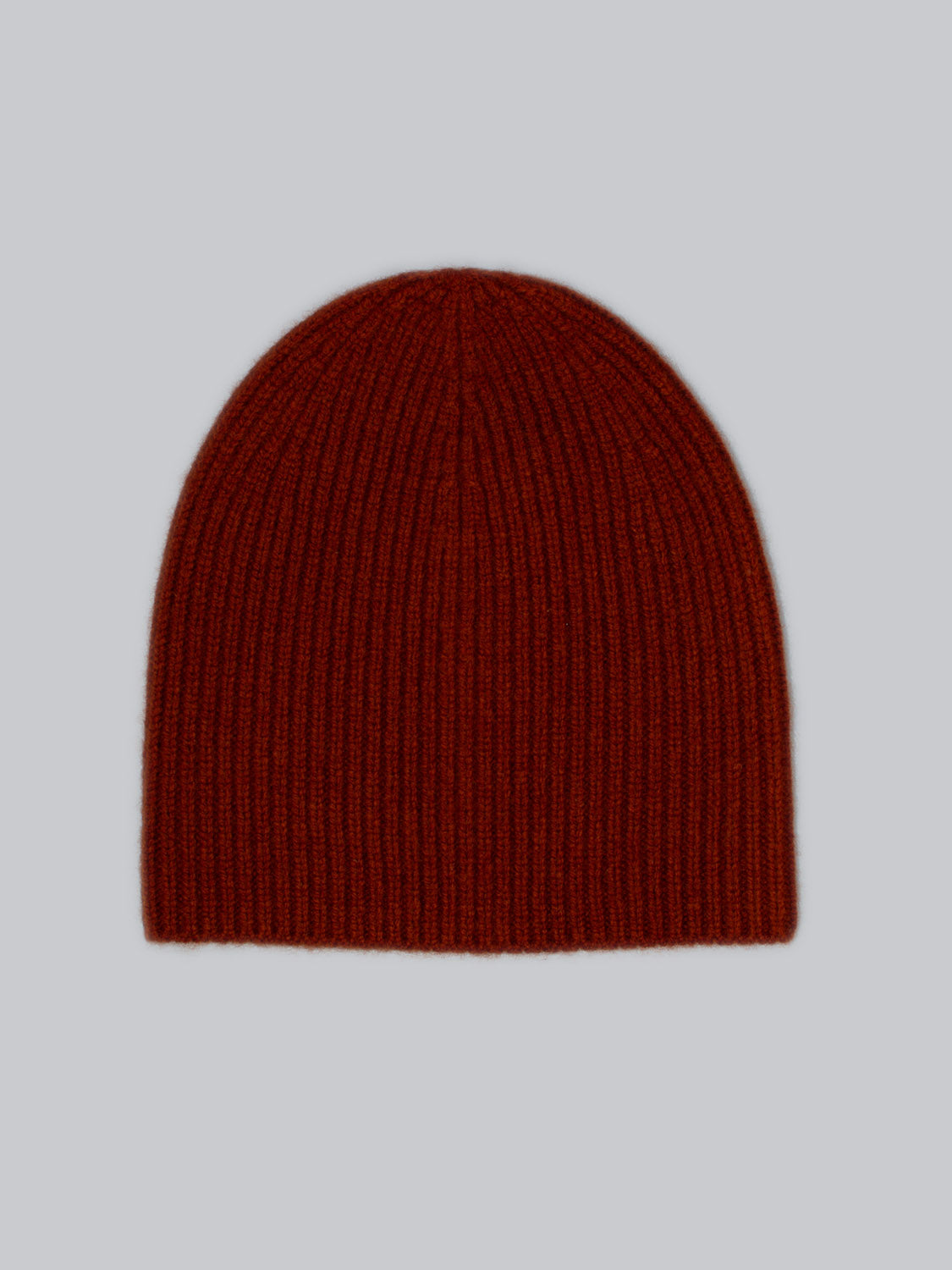 Introducing the Chamonix Wool Beanie by ID Menswear—a red, ribbed knit hat crafted from 100% wool for optimal insulation. Displayed on a light gray background, this beanie combines warmth and style perfectly.