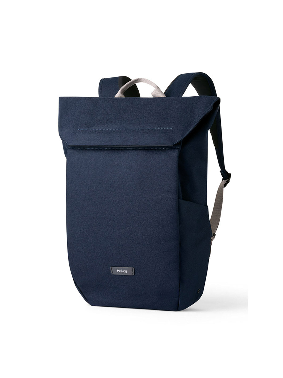 The Bellroy Melbourne Backpack Compact 13L is a minimalist navy blue backpack with a fold-over top, black shoulder straps, and a small front label, shown against a white background.