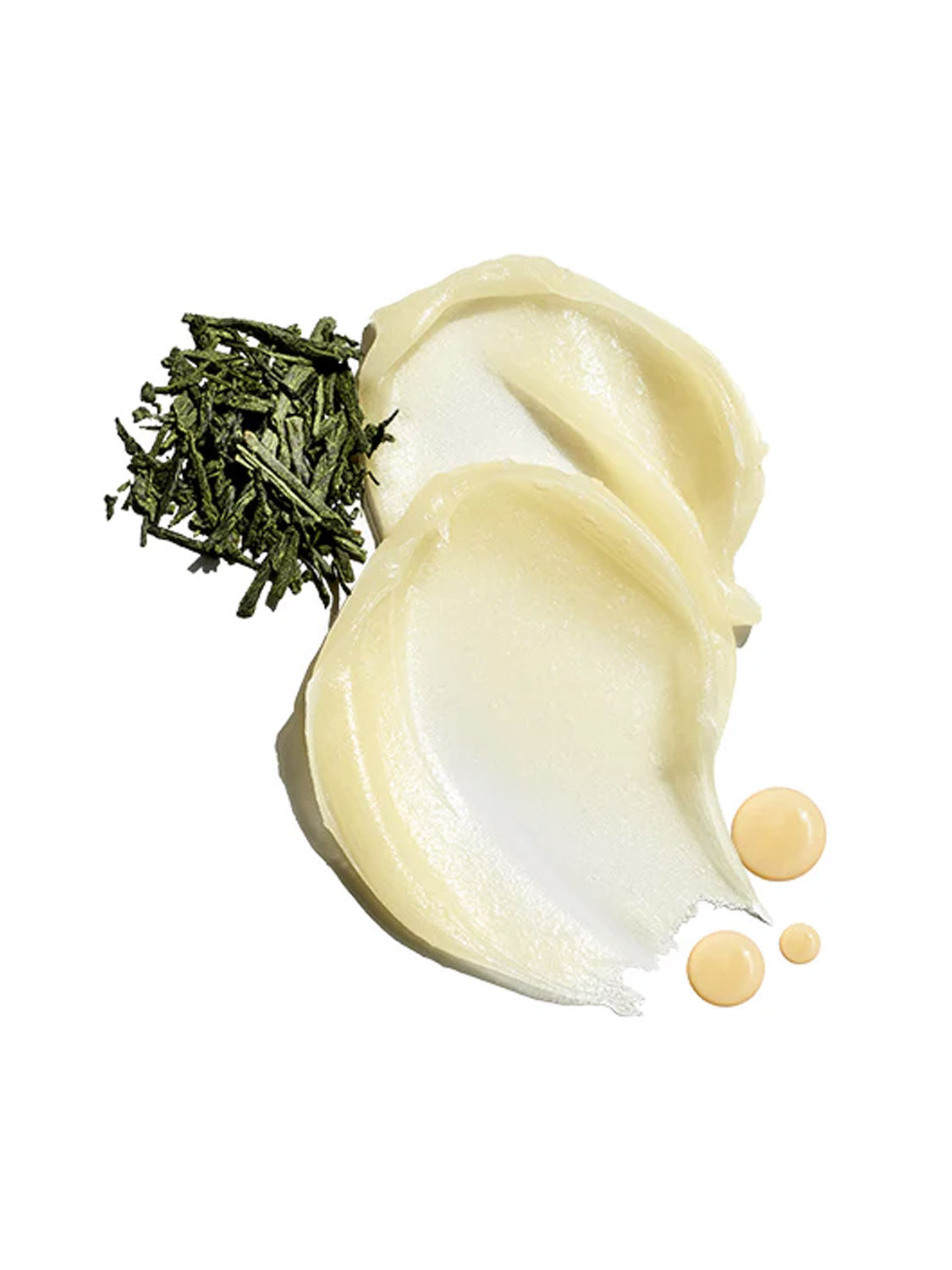 A smear of creamy, pale yellow Jack Black Intense Therapy Lip Balm is placed beside dried green leaves and three beige liquid drops on a white background.