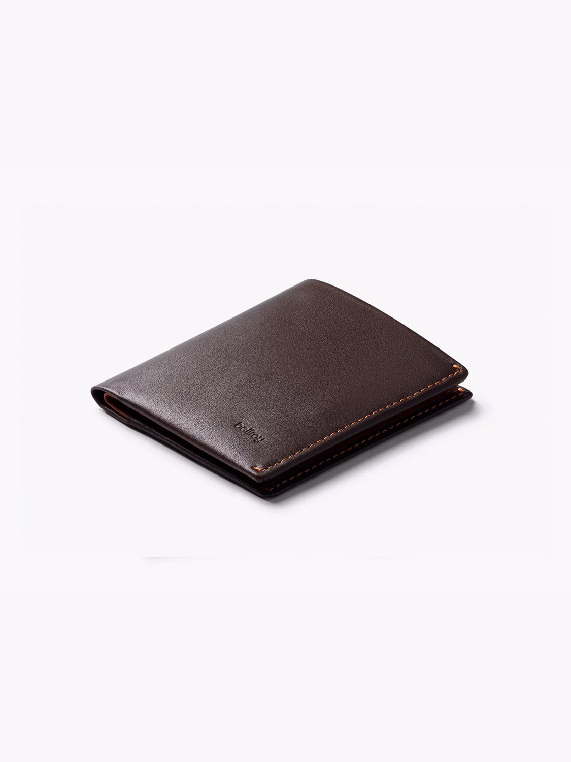 The Bellroy Note Sleeve Wallet is a closed, slim, dark brown leather wallet with visible stitching and RFID protection, shown on a plain white background.