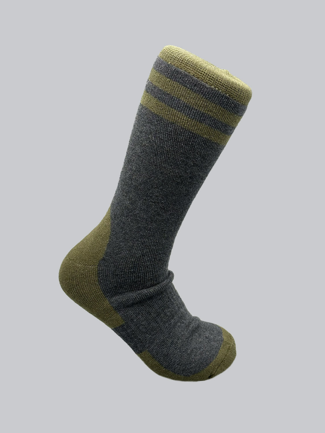 A gray Rockies Merino Wool Sock by ID Menswear, featuring a green heel, toe, and top band, rests on a light gray background, offering warmth and durability.