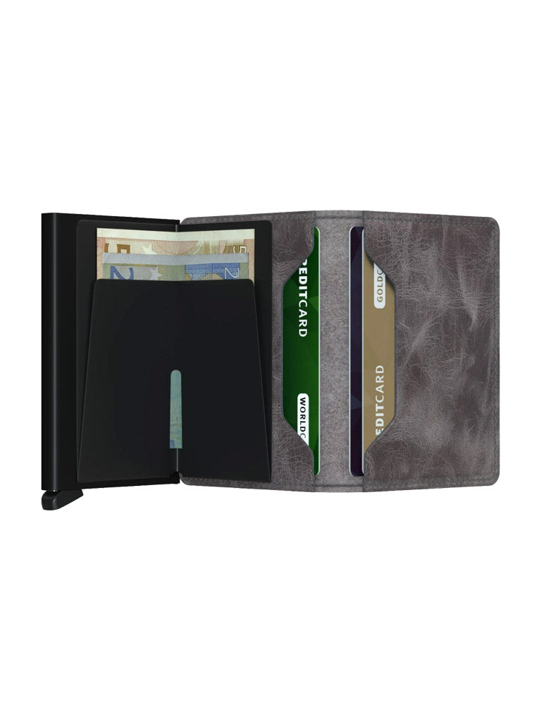 The Secrid Slimwallet Vintage Leather by Secrid features vintage gray leather, slots for three cards, a euro banknote compartment, a black divider, and offers RFID security for your peace of mind.
