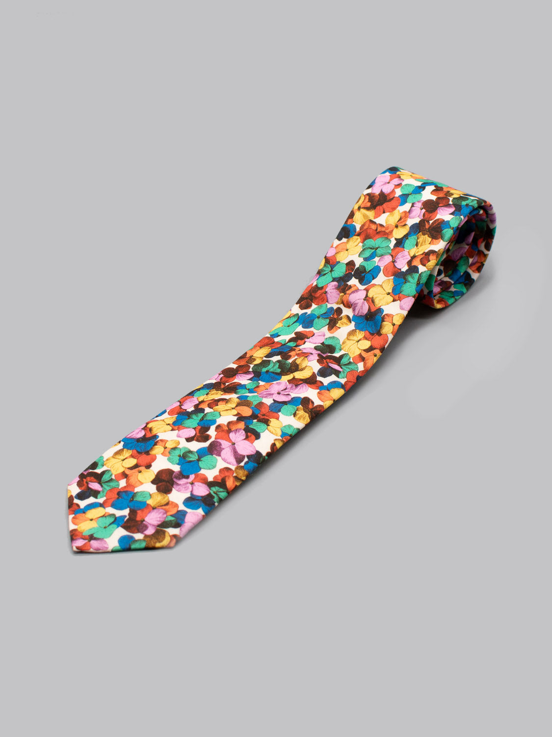The ID Menswear Liberty of London Tana Lawn™ Hilary Tie features a handmade design with colorful overlapping circles—yellow, orange, blue, pink, purple, and green—on a soft gray Tana Lawn cotton background.