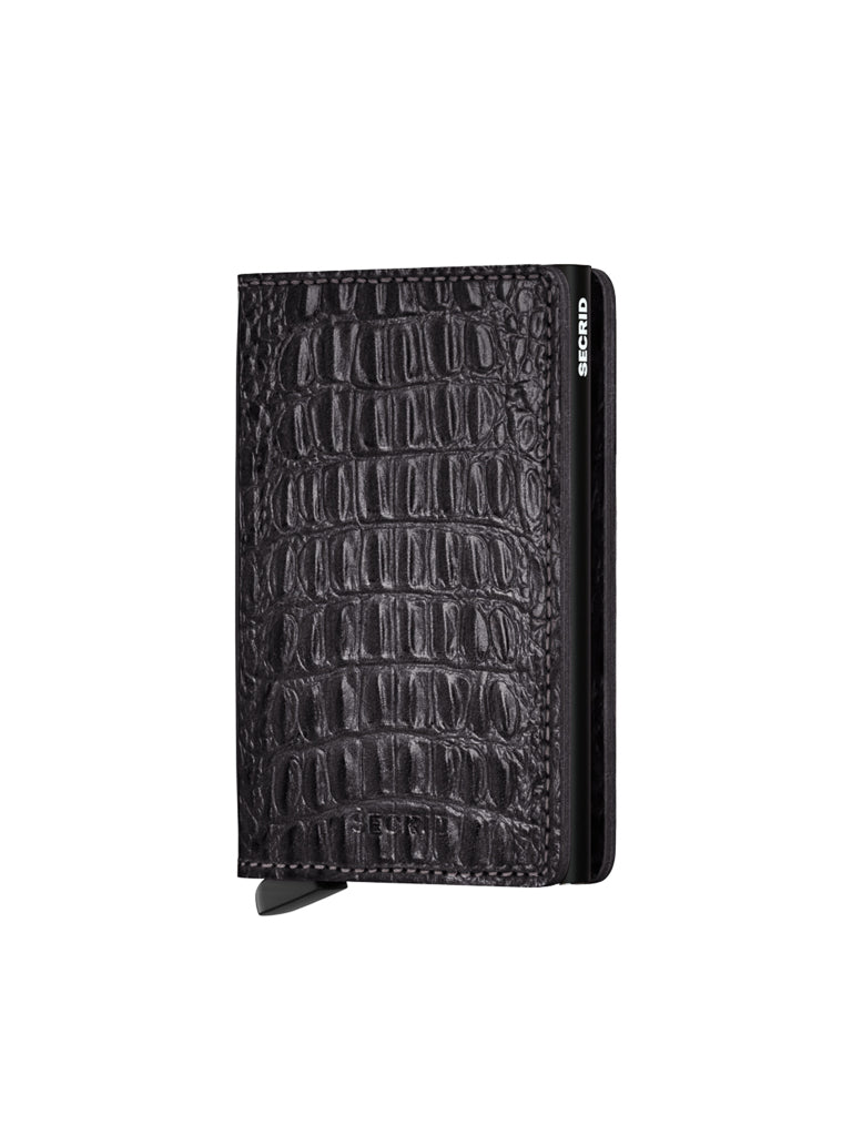 The Secrid Slimwallet Nile is a black, slim wallet with crocodile skin texture, RFID protection, and a metal clasp. The brand name is on the side. Shown against a white background.