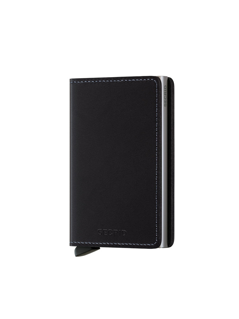 The Secrid Slimwallet Original, crafted from black European leather with visible stitching and a metal edge, stands upright on a white background. A small left-side tab provides built-in RFID protection.