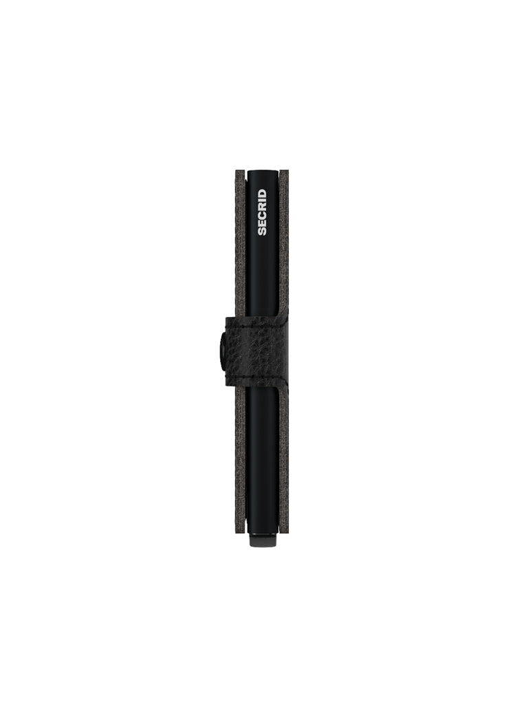 The Secrid Miniwallet Vegetable Tanned Leather is a slim, black wallet with a textured strap and vertically printed SECRID logo, displayed from above on a white background.