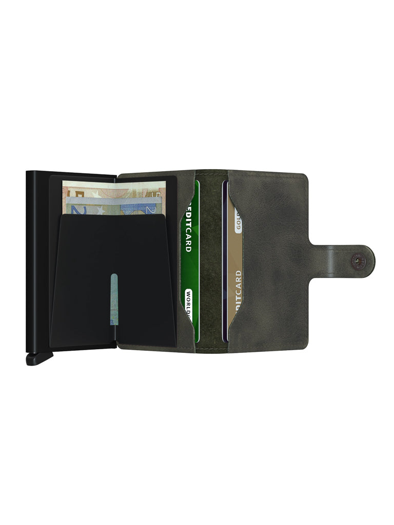 The Secrid Miniwallet Vintage Leather, shown open on a white background, reveals multiple credit cards, cash, and features a snap-button closure.
