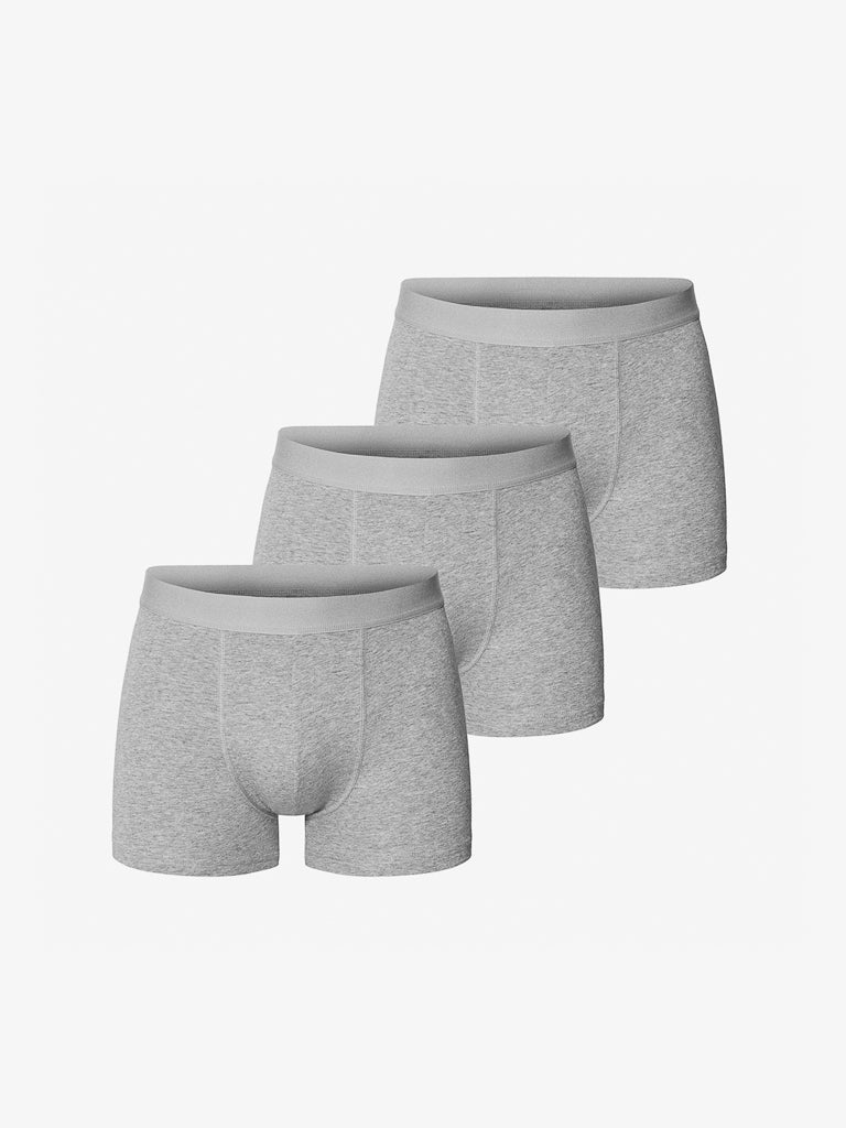 The Bread & Boxer 3 Pack Boxer Brief includes three pairs of gray mens boxer briefs, made from organic cotton with a soft elastic waistband and reinforced front, offering comfort and durability. These are arranged neatly against a white backdrop.
