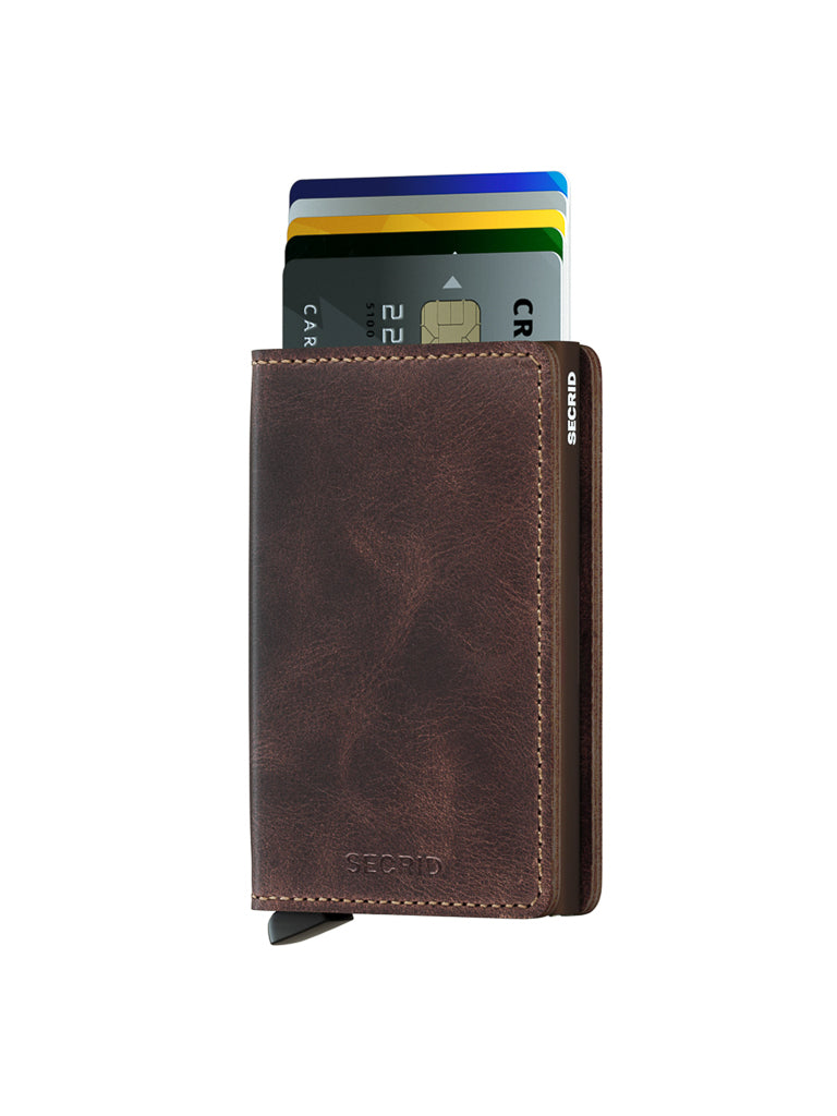The Secrid Slimwallet Vintage Leather, shown upright on a white background, displays several fanned credit cards and offers RFID protection.