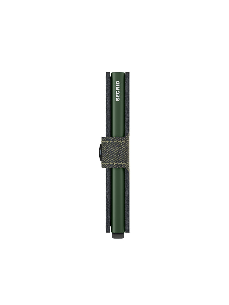 The Secrid Miniwallet Twist Twill Leather is a slim, green wallet with a textured band and black button closure. This compact accessory offers RFID protection and features a minimalist, stylish design.