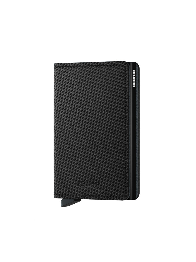 The Secrid Slimwallet Carbon Fibre Pattern Leather stands upright on a white background with a partially extended tab and SECRID in silver on the side. This slim leather wallet provides secure RFID protection.