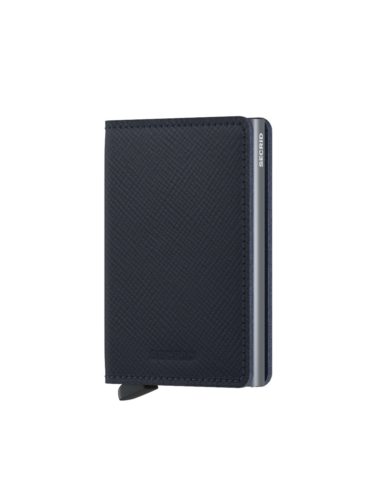 The Secrid Slimwallet Saffiano Leather, shown closed and in dark blue with a textured saffiano finish, metal edge, visible card access tab, and RFID protection, is photographed against a plain white background.
