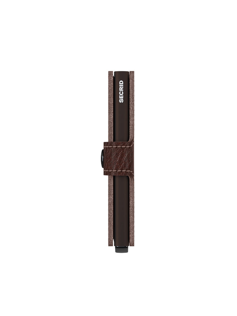 The Secrid Miniwallet Vegetable Tanned Leather is a slim brown wallet with visible branding on its black inner case, shown from the side against a white background.