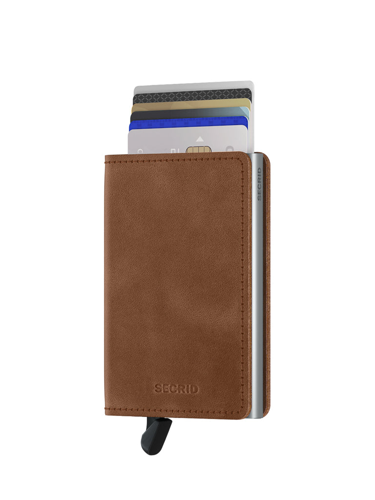 The Secrid Slimwallet Vintage Leather by Secrid is a brown, compact wallet with a small black lever, RFID security, and minimalist design, showing several cards neatly stacked inside.