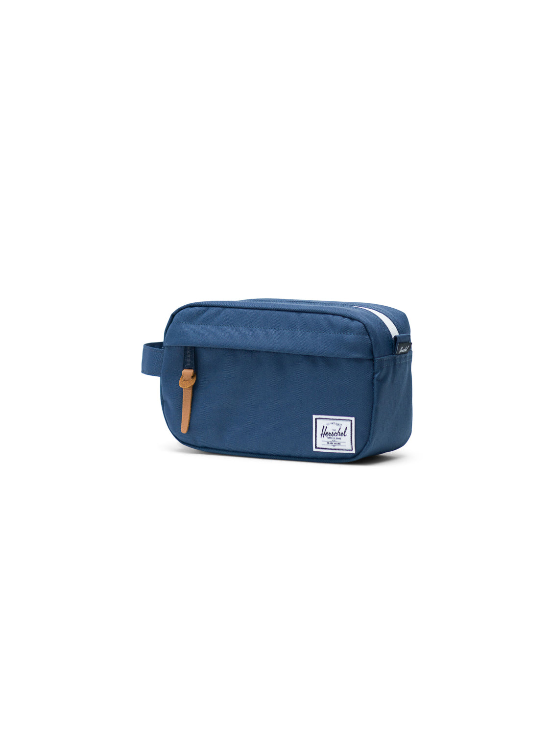The Herschel Chapter Carry-On Travel Kit is a blue rectangular bag with a waterproof zipper, brown leather pull tab, side handle, and a white Herschel label on the front, displayed on a plain white background.