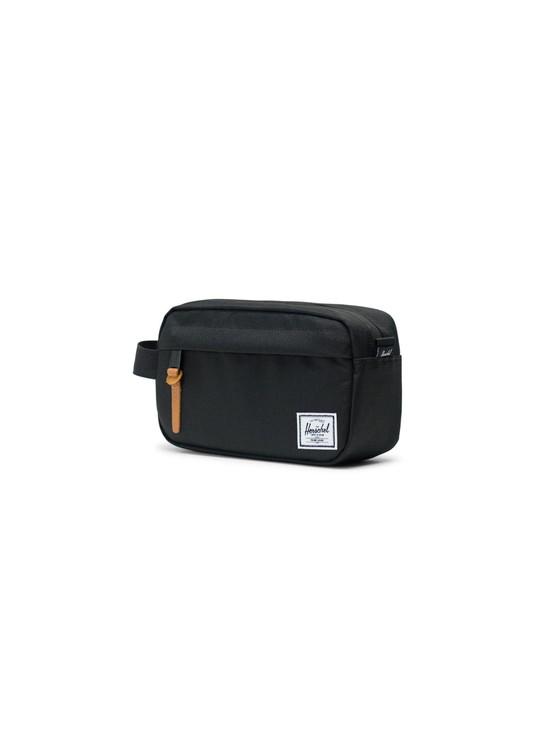 The Herschel Chapter Carry-On Travel Kit is a black rectangular bag with a waterproof zipper, brown leather zipper pull, side handle, and front white Herschel Supply Co. label, shown against a white background.