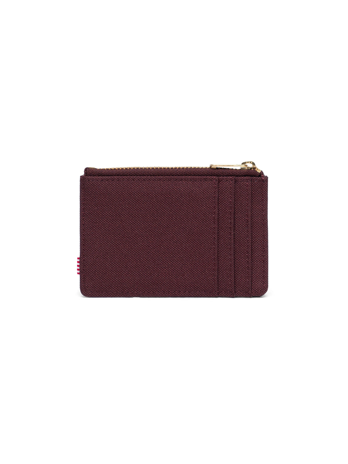 The Herschel Oscar Compact Wallet is a maroon fabric card holder with a top zipper and three front card slots, shown against a white background.