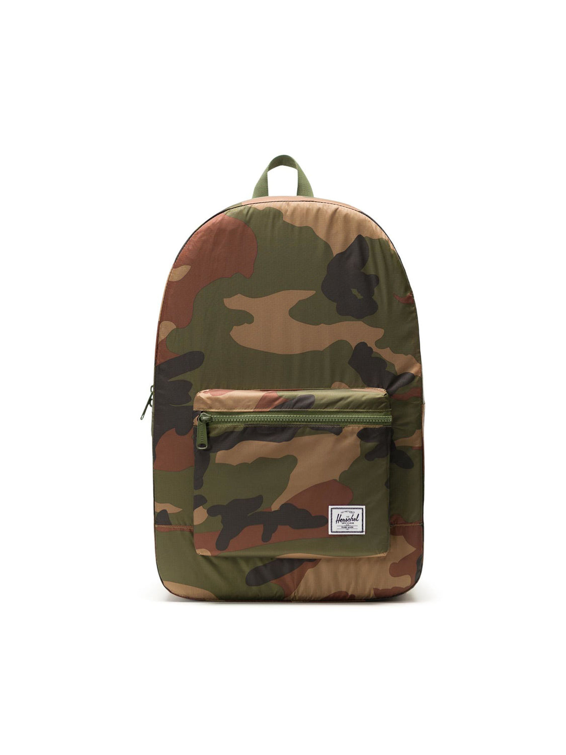 The Herschel Packable Daypack is a lightweight ripstop backpack with a camouflage pattern, adjustable shoulder straps, a front zippered pocket, and a small white label at the bottom right, shown against a plain white background.