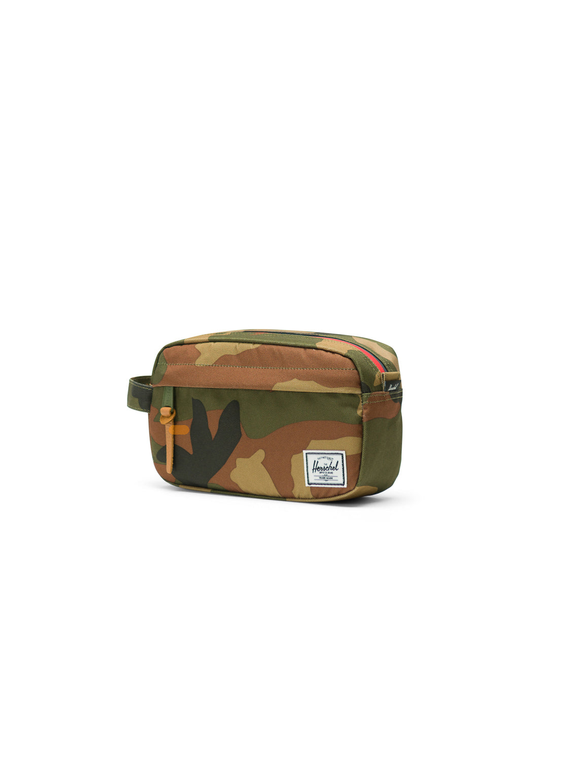 The Herschel Chapter Carry-On Travel Kit is a compact bag with a rectangular camouflage design, waterproof zipper, small side handle, and a white Herschel label on the front pocket, displayed on a plain white background.