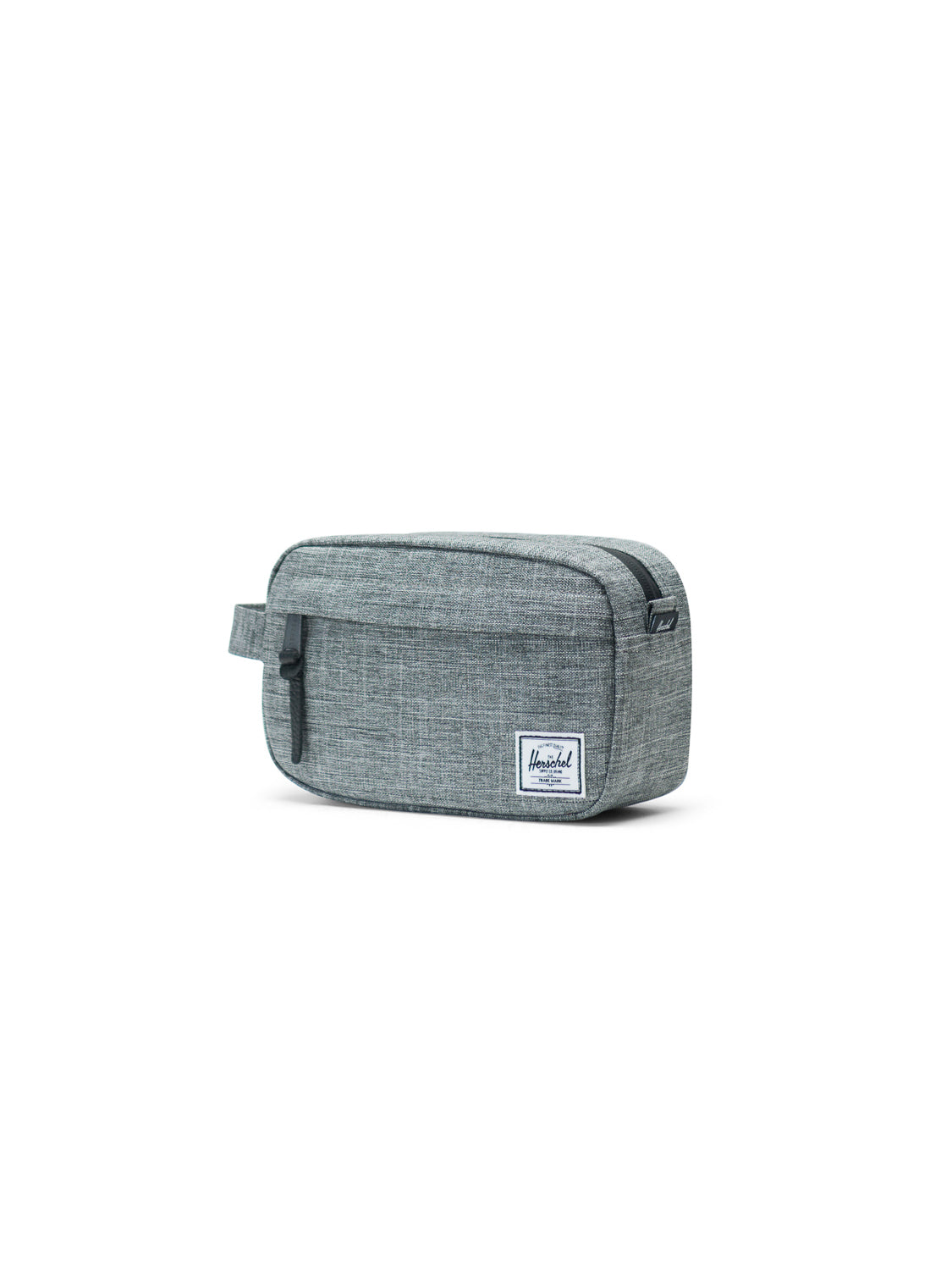 The Herschel Chapter Carry-On Travel Kit is a rectangular gray fabric bag with a side handle, waterproof zipper, and a small white rectangular brand label on the front, shown against a plain white background.