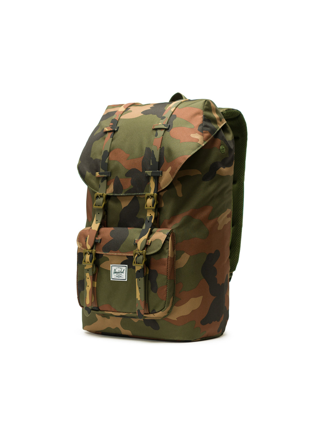 The Herschel Little America Iconic Backpack features a camouflage pattern, front pocket with white label, two buckle straps on the flap, and a built-in laptop sleeve, displayed against a white background.