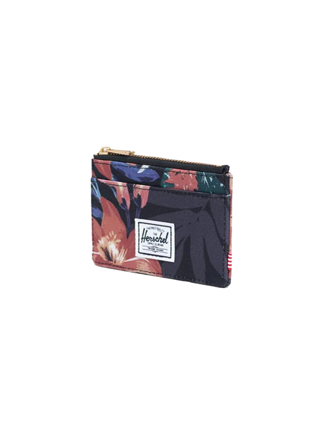 The Herschel Oscar Compact Wallet features a dark blue, red, and orange floral print, RFID blocking, a zippered top, a front pocket with the white Herschel label, and keeps your cards secure and stylish.