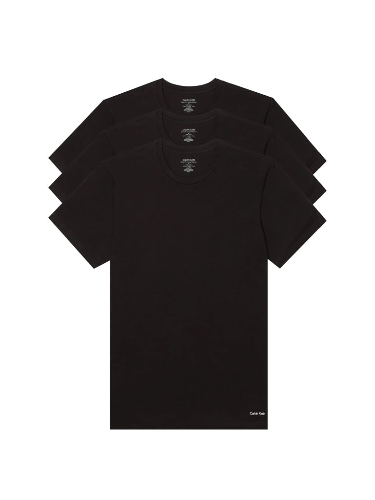 Three black Calvin Klein NB4051 Cotton Classic Crewneck Tees are stacked, each featuring a small logo near the bottom hem. The classic fit shirts are arranged so each one is partially visible behind the other.