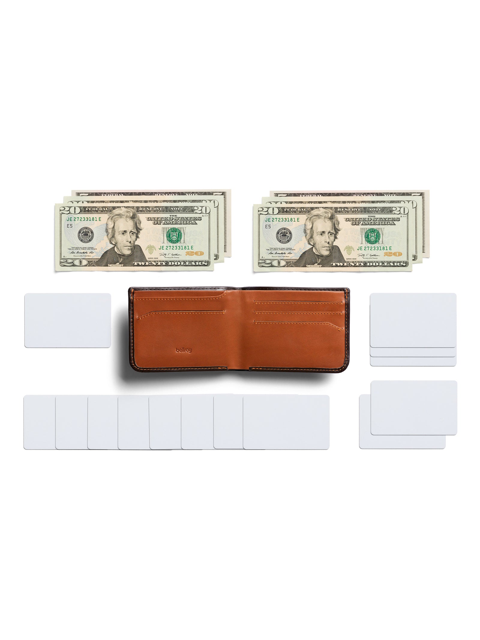 The Bellroy Hide and Seek Low Wallet, crafted from eco-tanned leather, is open on a white background, flanked by two stacks of $20 bills and several neatly arranged blank white cards.