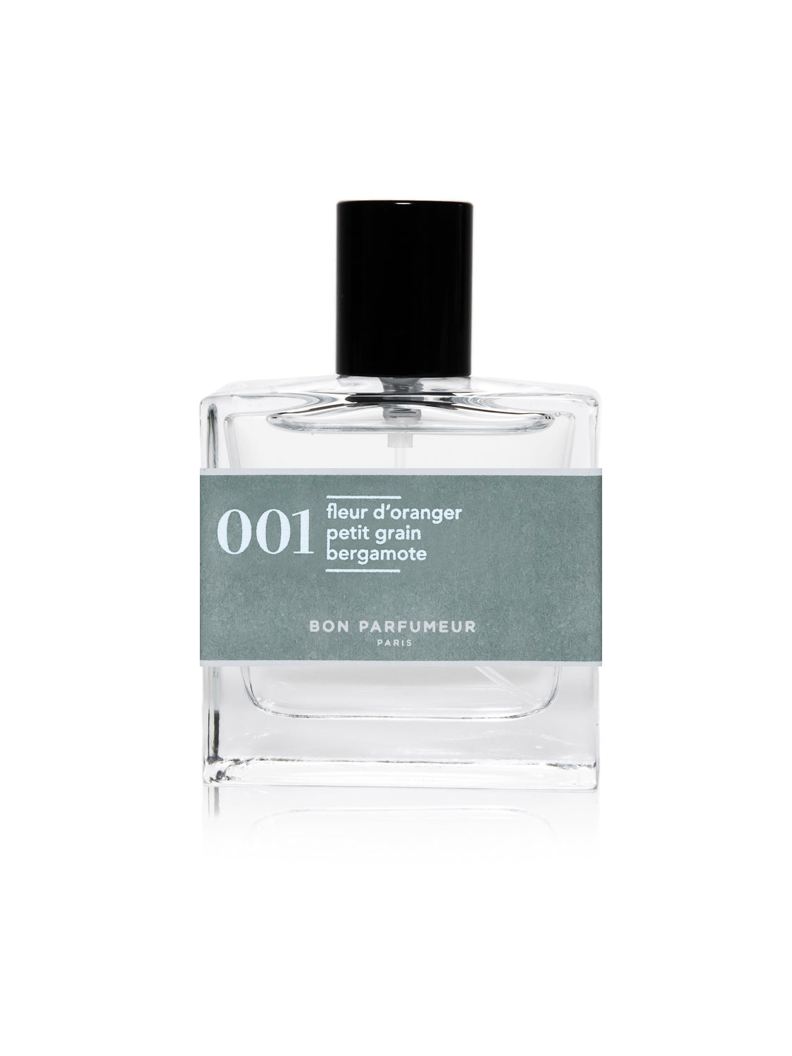 The sleek Bon Parfumeur - 001 perfume bottle features a clear glass design and black cap, with a light gray label detailing fleur doranger, petit grain, and bergamot over musky base notes. This modern citrus cologne stands out against its plain white background.