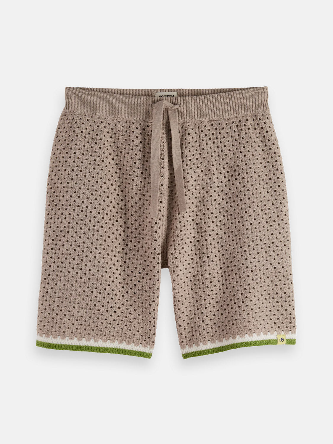 The SCOTCH AND SODA Crochet Knit Short 180344 SU25 in taupe features an eyelet pattern, ribbed elastic waistband with drawstring, and green and white trim at the leg openings.