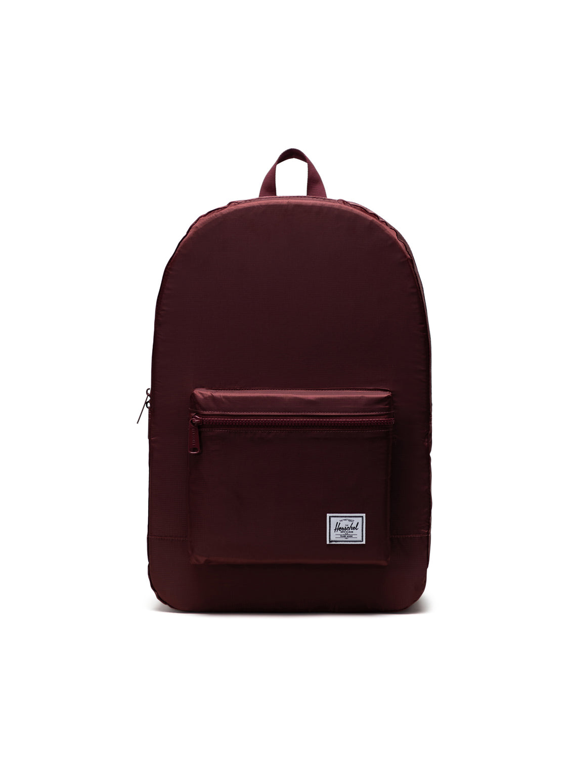 The Herschel Packable Daypack by Herschel features maroon ripstop fabric, a front zippered pocket, small white logo patch, adjustable shoulder straps, and a top handle, shown on a plain white background.