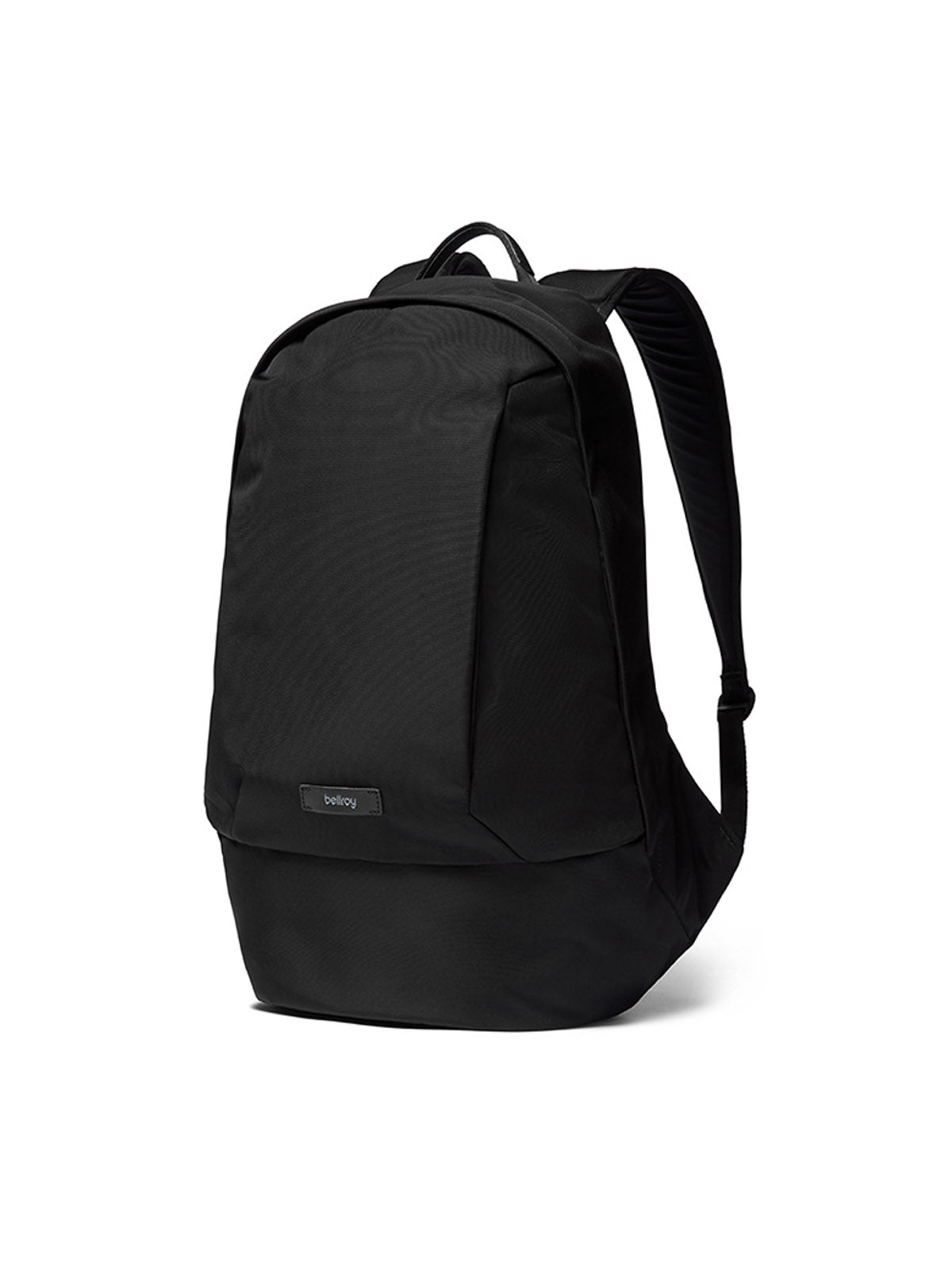The Bellroy Classic Backpack - 20L is a sleek black urban bag with a minimalist design, made from recycled materials, featuring a small front label, padded shoulder straps, and a sturdy top handle against a plain white background.
