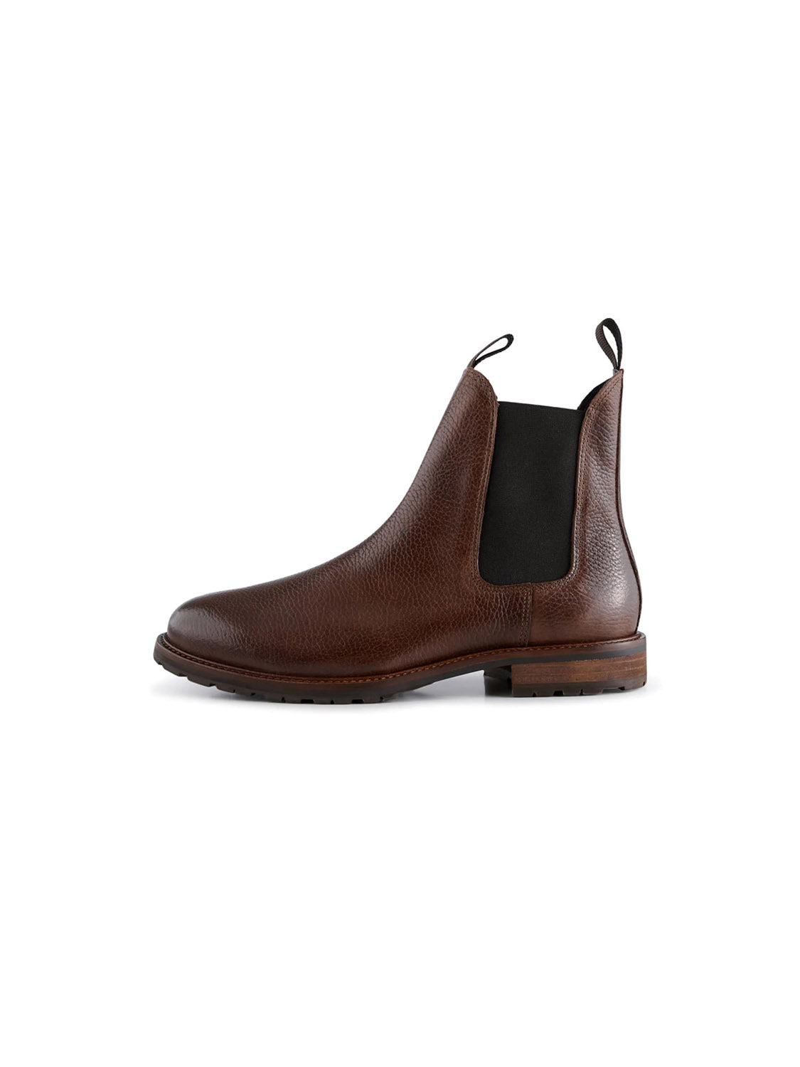 The York Classic Chelsea Boot by Shoe The Bear is crafted from LWG-certified brown leather with a textured finish, black elastic side panels, and pull tabs. It features a low wooden heel and dark flexible rubber outsole, showcased on a white background.