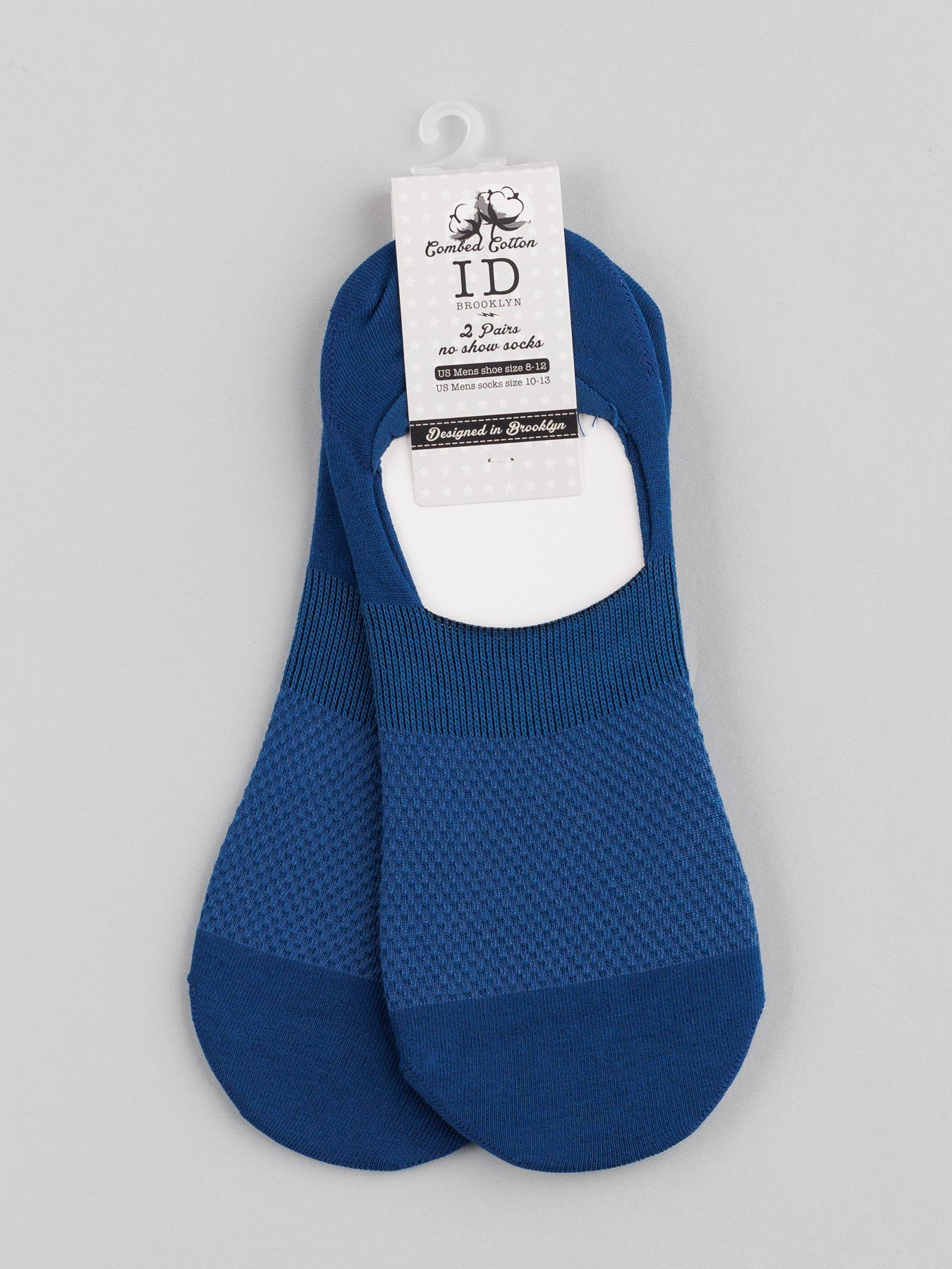 ID Menswears M1 No Show Socks, made of soft combed cotton and featuring a textured pattern, are shown against a gray background. Designed for low-cut shoes, they are finished with a white tag that displays decorative branding.