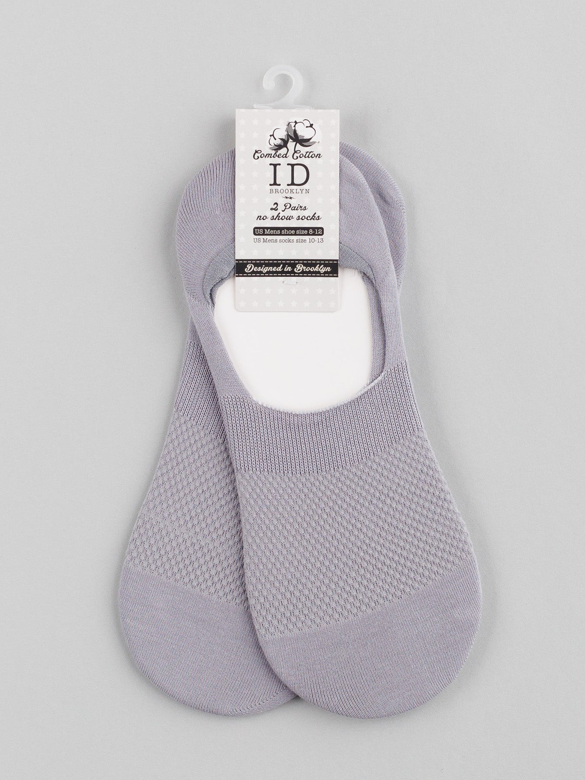 A pair of ID Menswears M1 No Show Socks in light gray, featuring a textured pattern, is displayed on a plain background. Designed in Sweden and made from bamboo fibers, these socks offer ultimate comfort and are perfect for low-cut shoes.