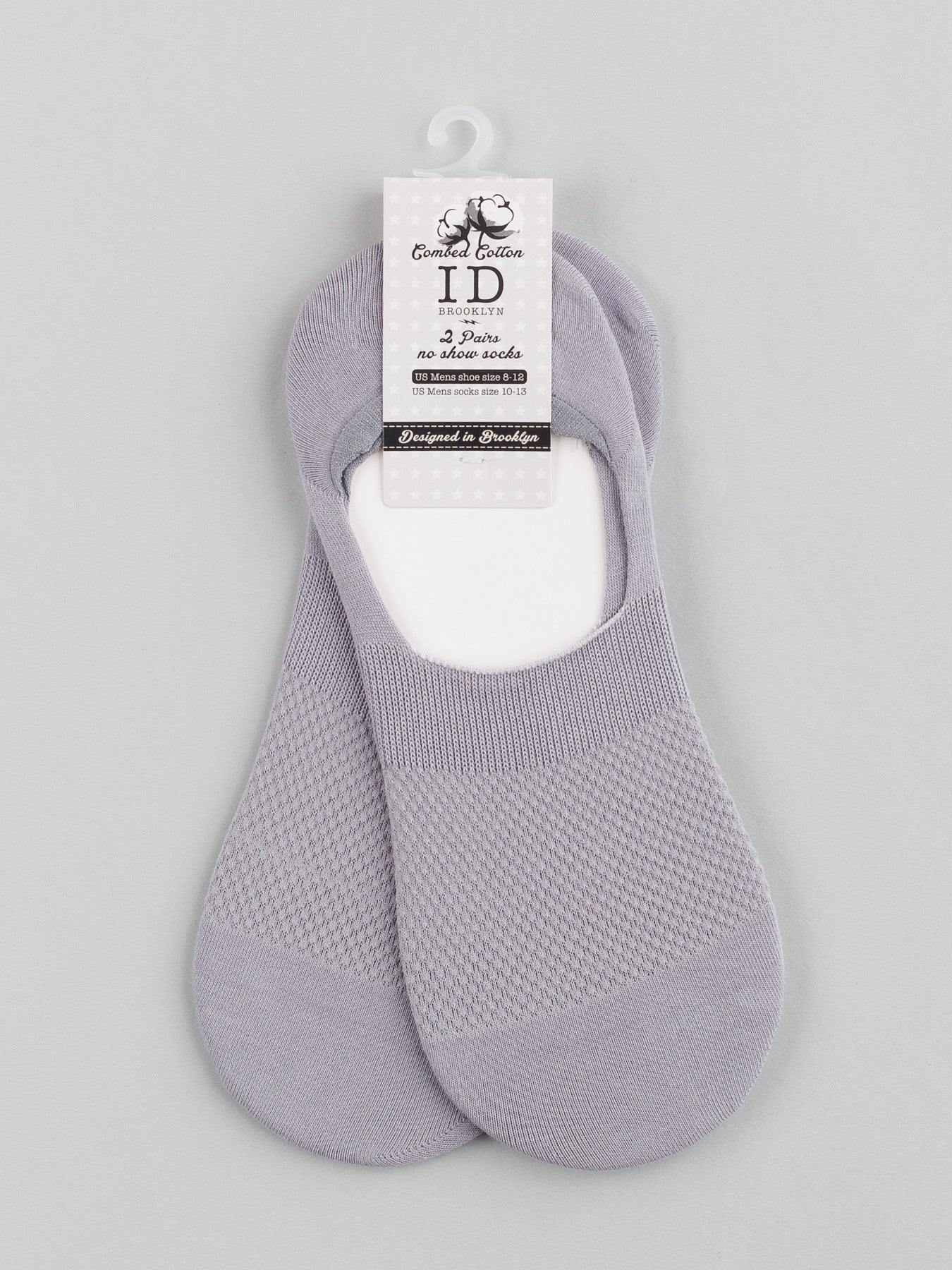 A pair of ID Menswears M1 No Show Socks in light gray, featuring a textured pattern, is displayed on a plain background. Designed in Sweden and made from bamboo fibers, these socks offer ultimate comfort and are perfect for low-cut shoes.