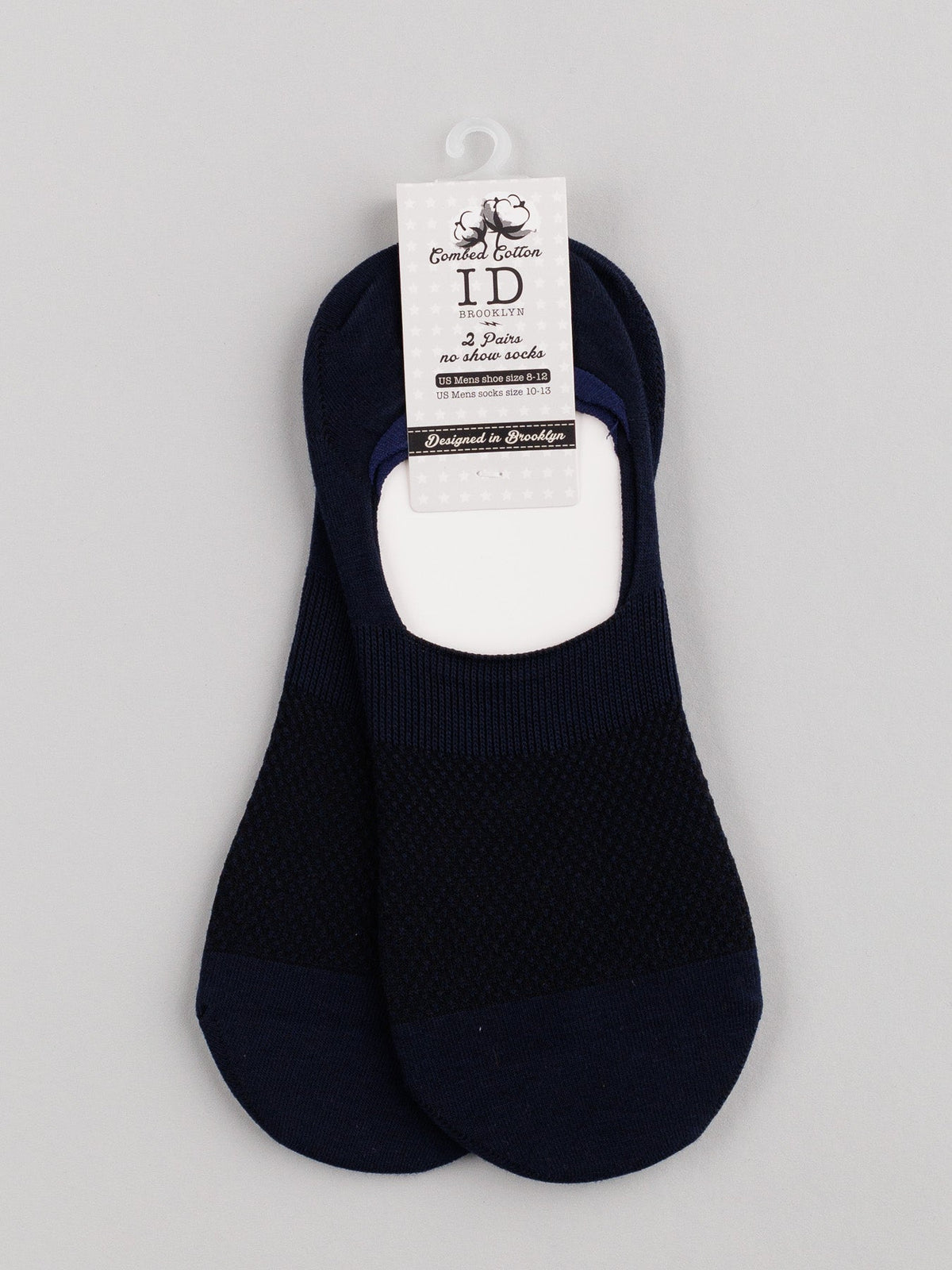 ID Menswears M1 No Show Socks in black, made from soft combed cotton with a mesh-like pattern perfect for low-cut shoes, are showcased on light gray background with a cardboard label displaying brand and product details.