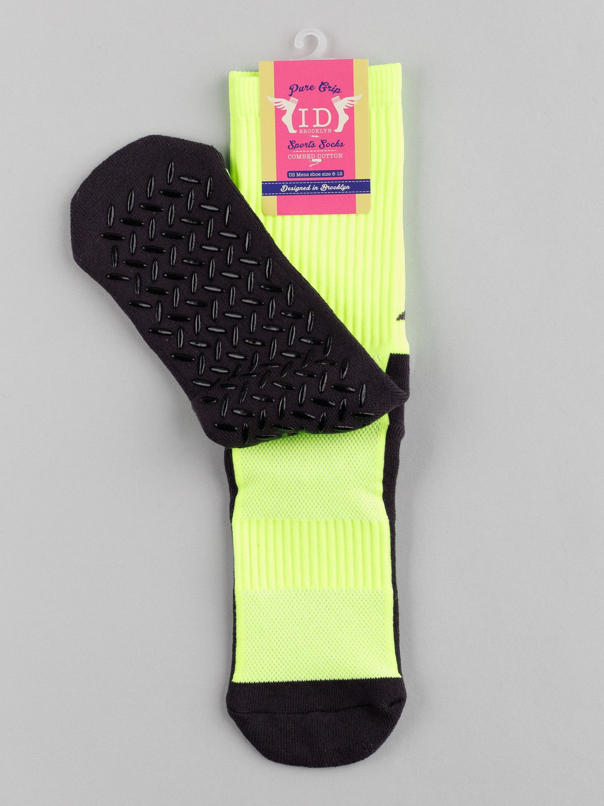The Grip Sports Socks by ID Menswear are showcased in a bright yellow with a black anti-slip sole, facing forward. The top label highlights the brand and features, ensuring optimal performance and comfort for every step.