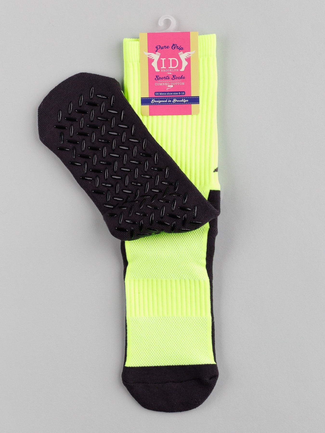 The Grip Sports Socks by ID Menswear are showcased in a bright yellow with a black anti-slip sole, facing forward. The top label highlights the brand and features, ensuring optimal performance and comfort for every step.